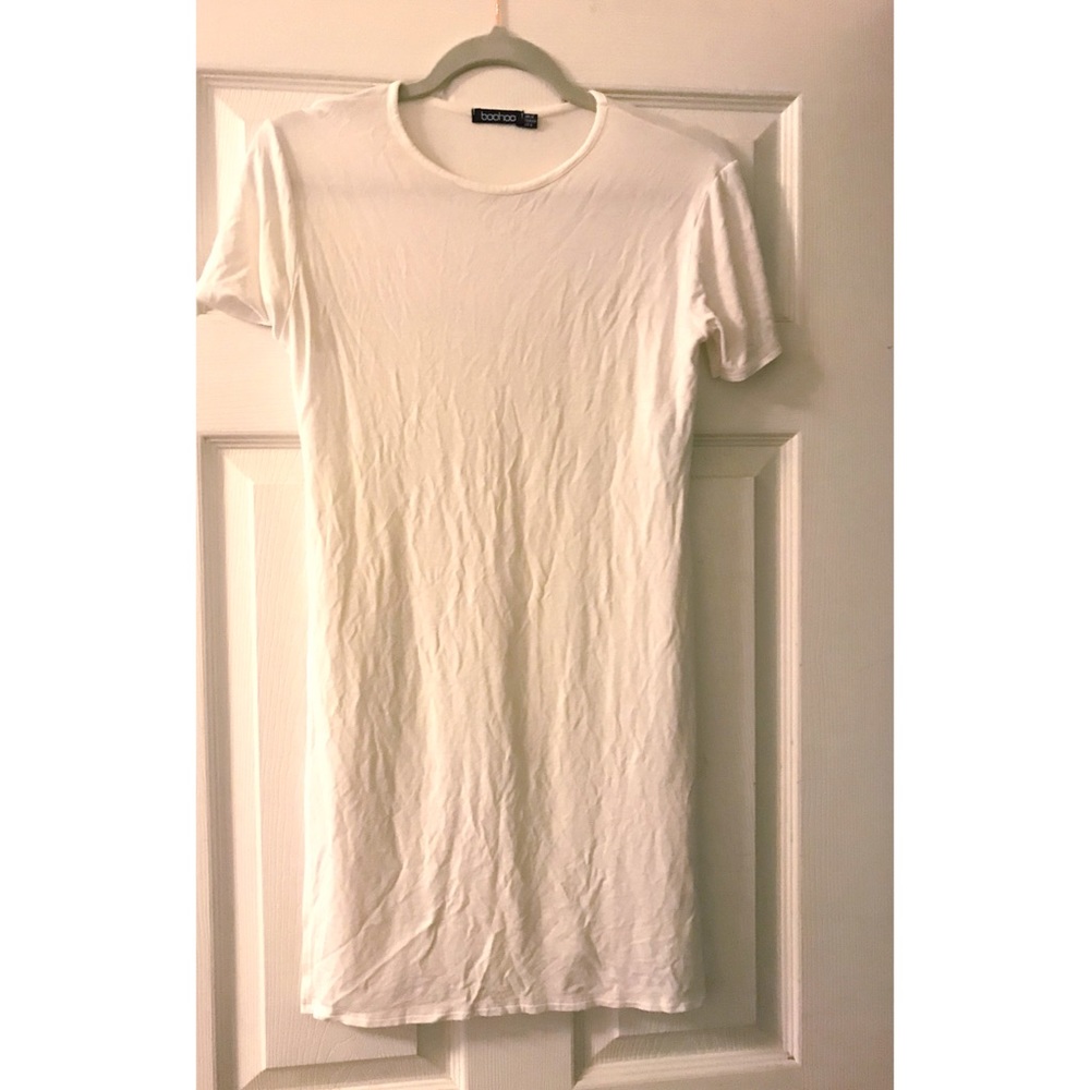 Cream/white colored tunic.